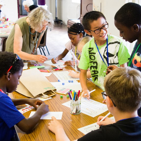 Children at Collinwood Road United Reformed Church in Oxford crafting and drawing as part of an all-age service
